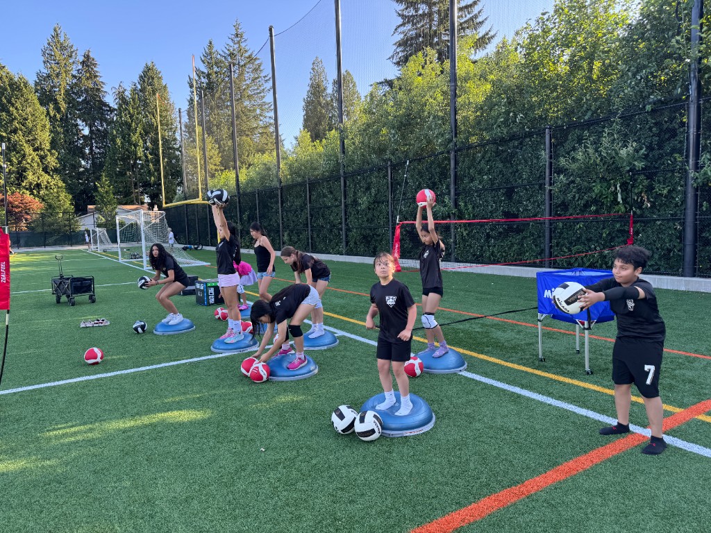 Group of youth athletes training outdoors during Summer 2026
